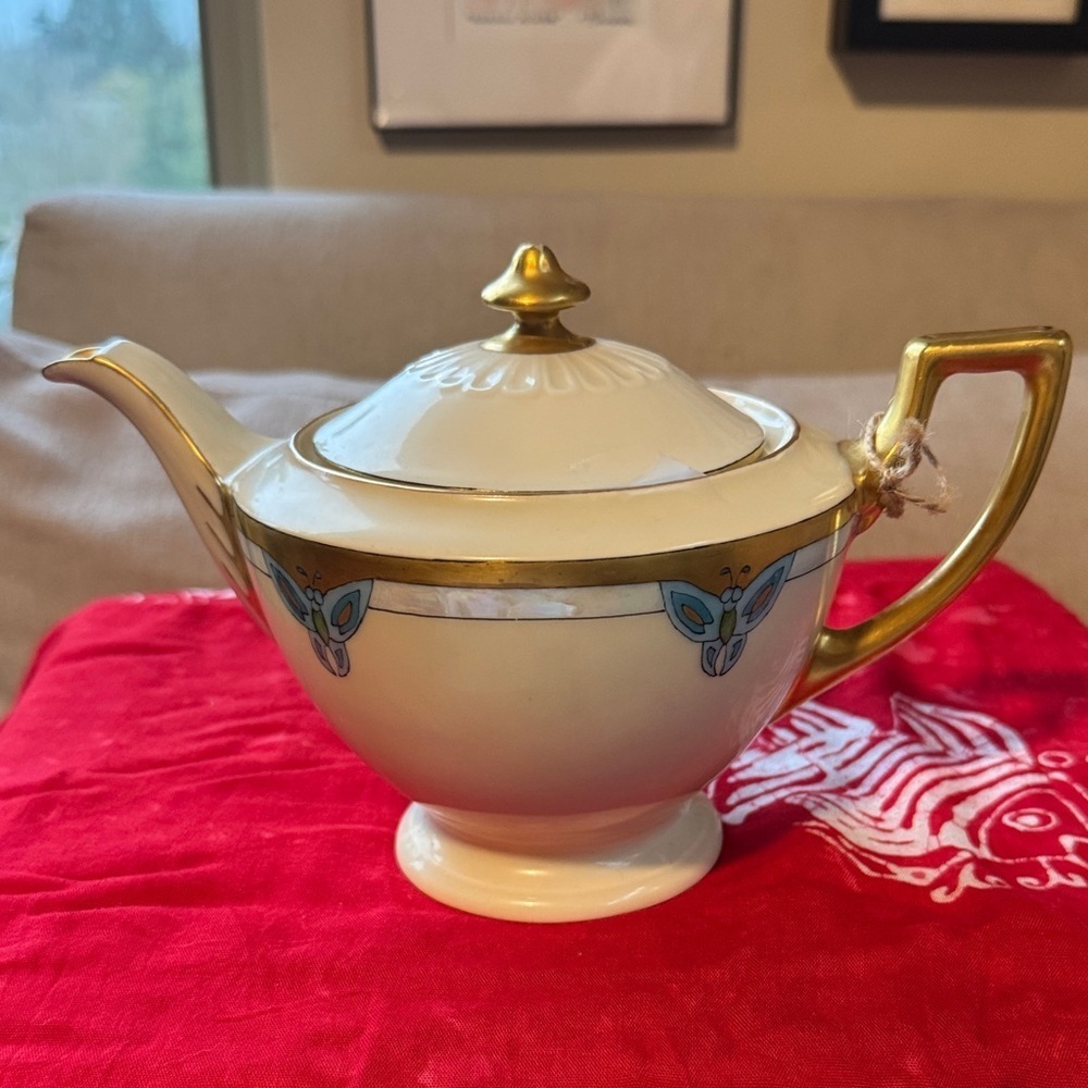 Elegant Gold and Cream Teapot with Blue Accents